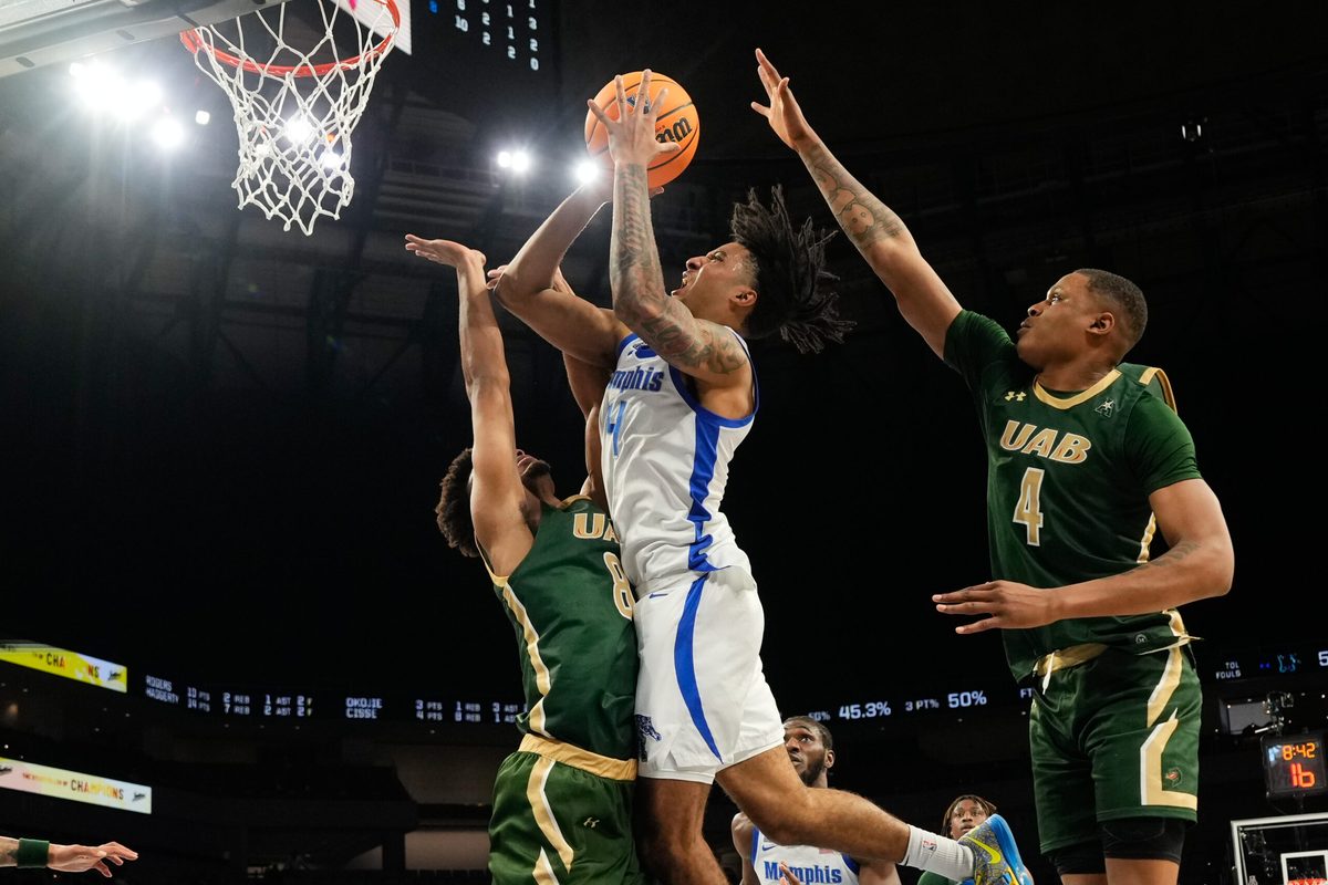 Mar 16, 2025; Fort Worth, TX, USA; Memphis Tigers guard PJ Haggerty (4) scores a basket over UAB Blazers guard Efrem Johnson (8) during the second half at Dickies Arena. Mandatory Credit: Chris Jones-Imagn Images