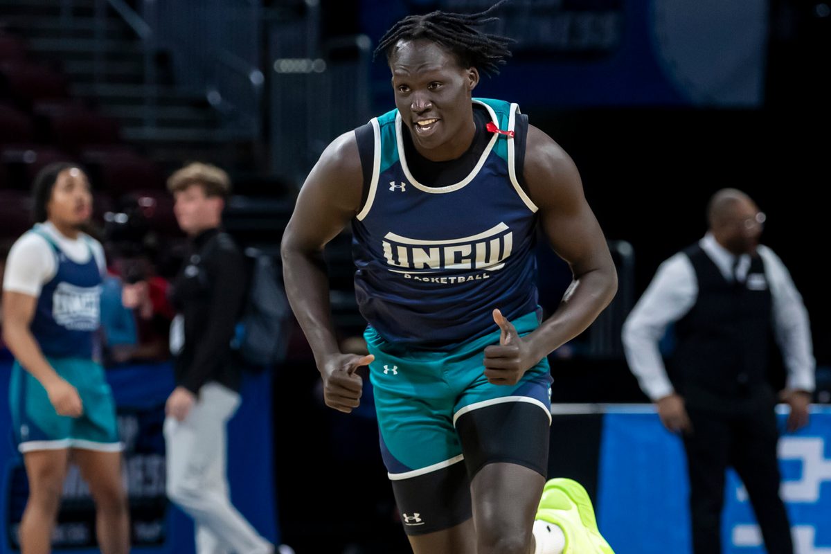 Mar 19, 2025; Wichita, KS, USA; UNC-Wilmington Seahawks forward Makoi Mabor (13) jogs up the court during a practice session at Intrust Bank Arena. Mandatory Credit: Nick Tre. Smith-Imagn Images