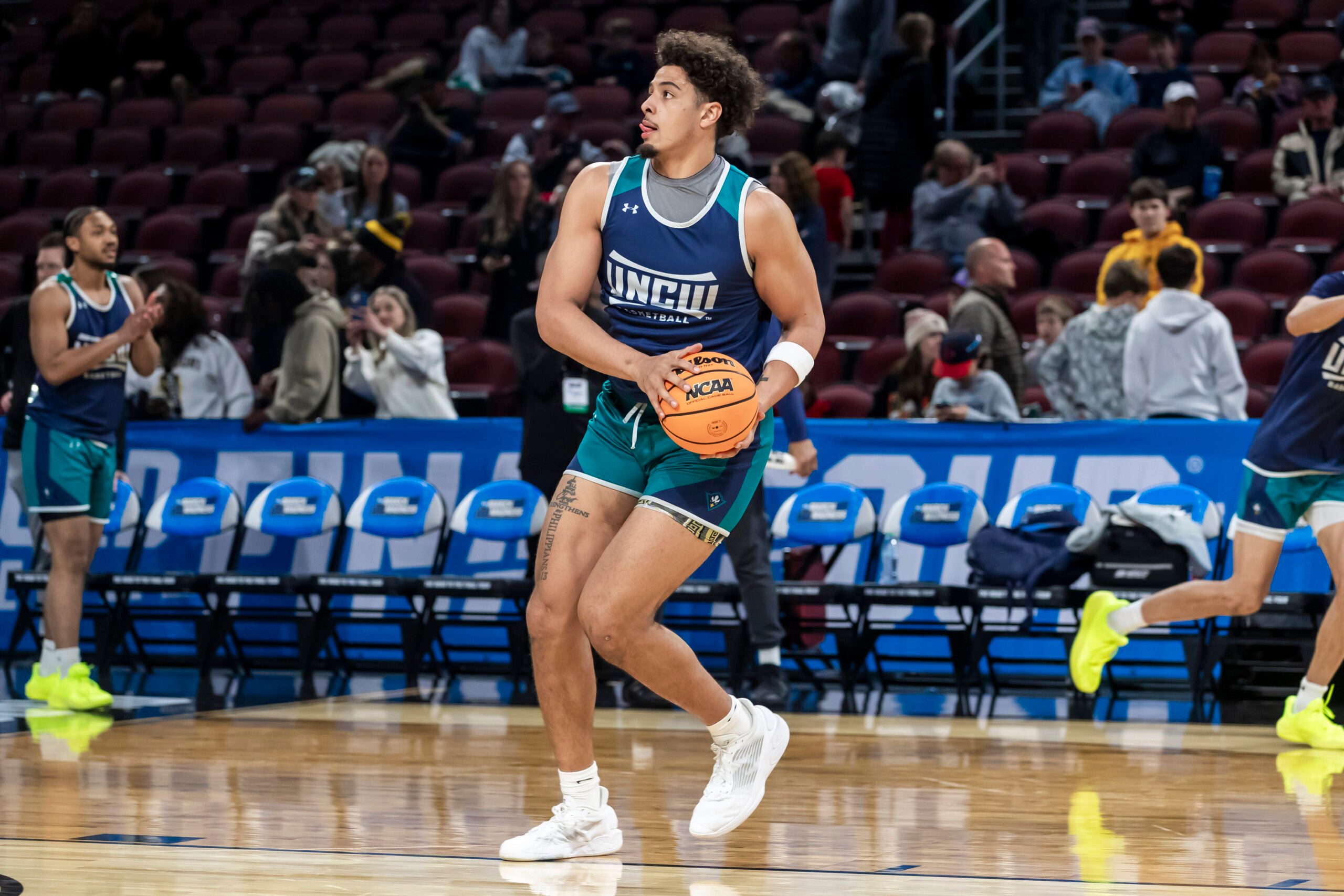 Mar 19, 2025; Wichita, KS, USA;  UNC-Wilmington Seahawks forward Harlan Obioha (55) drives toward the basket during a practice session at Intrust Bank Arena. Mandatory Credit: Nick Tre. Smith-Imagn Images