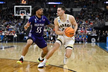 Mar 20, 2025; Providence, RI, USA; Purdue Boilermakers forward Camden Heide (23) controls the ball against High Point Panthers guard Bobby Pettiford (55) during the second half at Amica Mutual Pavilion. Mandatory Credit: Eric Canha-Imagn Images