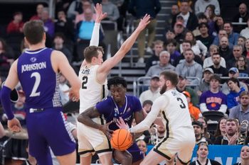 Mar 20, 2025; Providence, RI, USA; High Point Panthers forward Terry Anderson (0) loses control of the ball against Purdue Boilermakers guard Braden Smith (3) and guard Fletcher Loyer (2) during the first half at Amica Mutual Pavilion. Mandatory Credit: Gregory Fisher-Imagn Images
