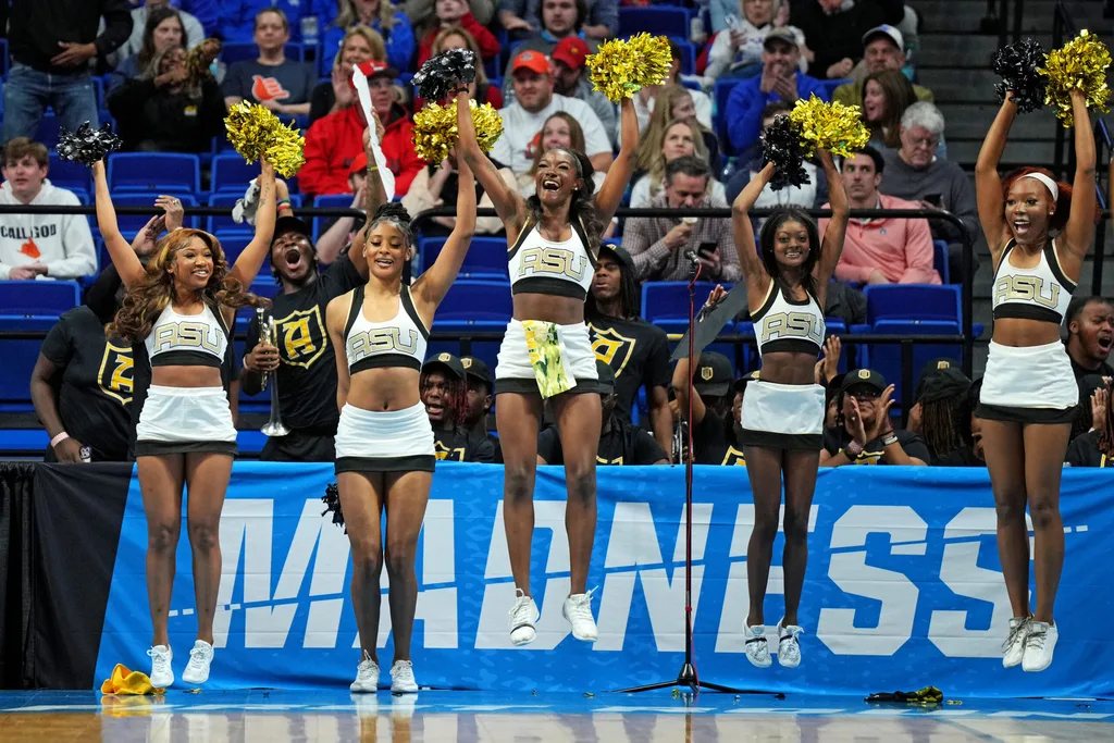 Mar 20, 2025; Lexington, KY, USA; Alabama State Hornets cheerleaders cheer during the first half of the game between the Auburn Tigers and the Alabama State Hornets in the first round of the NCAA Tournament at Rupp Arena. Mandatory Credit: Aaron Doster-Imagn Images