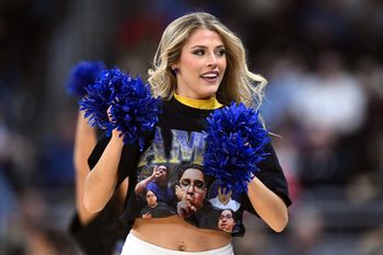 Mar 22, 2025; Providence, RI, USA; McNeese State Cowboys cheerleaders wear shirts with McNeese State Cowboys manager Amir Khan (not pictured) during a second round men’s NCAA Tournament game against the Purdue Boilermakers at Amica Mutual Pavilion. Mandatory Credit: Brian Fluharty-Imagn Images