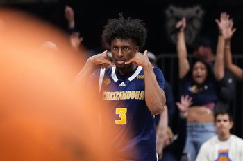 Chattanooga Mocs guard Honor Huff (3) celebrat4es scoring a three point basket Thursday, April 3, 2025, during the National Invitional Tournament at Hinkle Fieldhouse in Indianapolis.