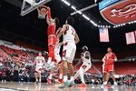 Oct 25, 2025; Pullman, WA, USA; New Mexico Lobos forward Tomislav Buljan (10) dunks the ball against Washington State Cougars guard Adria Rodriguez (13) in the first half at Friel Court at Beasley Coliseum. Mandatory Credit: James Snook-Imagn Images