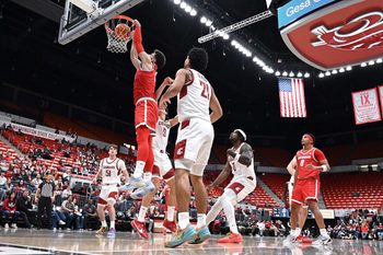 Oct 25, 2025; Pullman, WA, USA; New Mexico Lobos forward Tomislav Buljan (10) dunks the ball against Washington State Cougars guard Adria Rodriguez (13) in the first half at Friel Court at Beasley Coliseum. Mandatory Credit: James Snook-Imagn Images