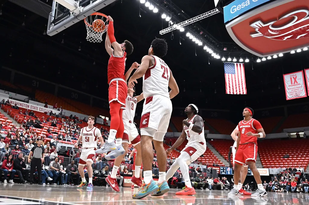 Oct 25, 2025; Pullman, WA, USA; New Mexico Lobos forward Tomislav Buljan (10) dunks the ball against Washington State Cougars guard Adria Rodriguez (13) in the first half at Friel Court at Beasley Coliseum. Mandatory Credit: James Snook-Imagn Images