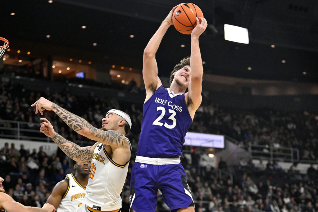 Nov 3, 2025; Providence, Rhode Island, USA; Holy Cross Crusaders forward Aidan Richard (23) beats Providence Friars forward Duncan Powell (31) to the rebound during the second half at Amica Mutual Pavilion. Mandatory Credit: Eric Canha-Imagn Images