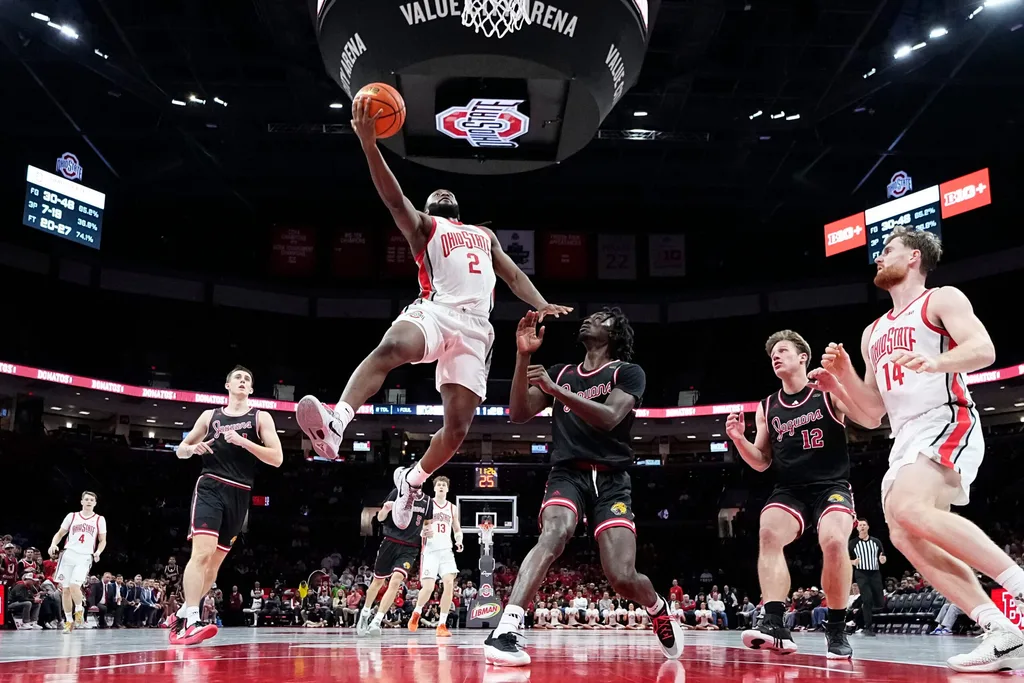 Ohio State Buckeyes guard Bruce Thornton (2) shoots over IU Indy Jaguars guard Jaxon Edwards (0) during the NCAA men's basketball game at Value City Arena in Columbus on Nov. 3, 2025. Ohio State won the season opener 118-102.