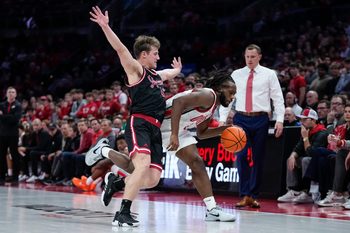 Ohio State Buckeyes guard Bruce Thornton (2) dribbles by IU Indy Jaguars guard Kyler D'Augustino (12) during the NCAA men's basketball game at Value City Arena in Columbus on Nov. 3, 2025. Ohio State won the season opener 118-102.