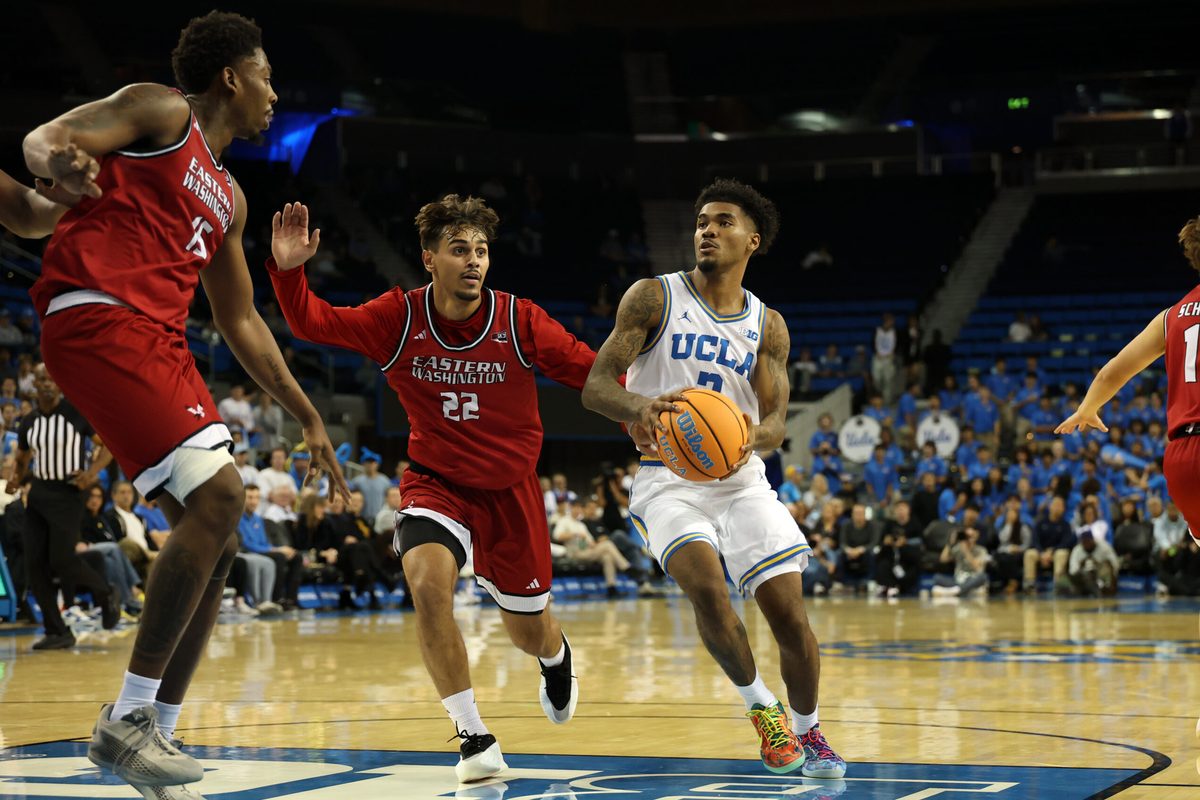 Nov 3, 2025; Los Angeles, California, USA;  UCLA Bruins guard Donovan Dent (2) drives to the basket against Eastern Washington Eagles guard Jojo Anderson (22) during the second half at Pauley Pavilion presented by Wescom Financial. Mandatory Credit: Kiyoshi Mio-Imagn Images