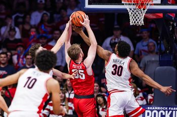 Nov 7, 2025; Tucson, Arizona, USA; Utah Tech Trailblazers forward Ethan Potter (35) and Arizona Wildcats forward Tobe Awaka (30) both reach for the rebound during the second half of the game at McKale Memorial Center. Mandatory Credit: Aryanna Frank-Imagn Images