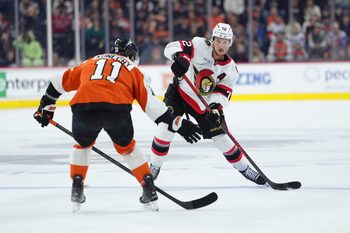 Nov 8, 2025; Philadelphia, Pennsylvania, USA; Ottawa Senators defenseman Thomas Chabot (72) passes the puck against Philadelphia Flyers right wing Travis Konecny (11) in the first period at Xfinity Mobile Arena. Mandatory Credit: Kyle Ross-Imagn Images