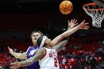 Nov 8, 2025; Salt Lake City, Utah, USA; Utah Utes guard Terrence Brown (2) goes to the basket against Weber State Wildcats forward Viljami Vartiainen (8) during the second half at Jon M. Huntsman Center. Mandatory Credit: Rob Gray-Imagn Images