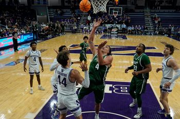Nov 10, 2025; Evanston, Illinois, USA; Northwestern Wildcats guard Angelo Ciaravino (44) defends Cleveland State Vikings forward Preist Ryan (4) during the first half at Welsh-Ryan Arena. Mandatory Credit: David Banks-Imagn Images