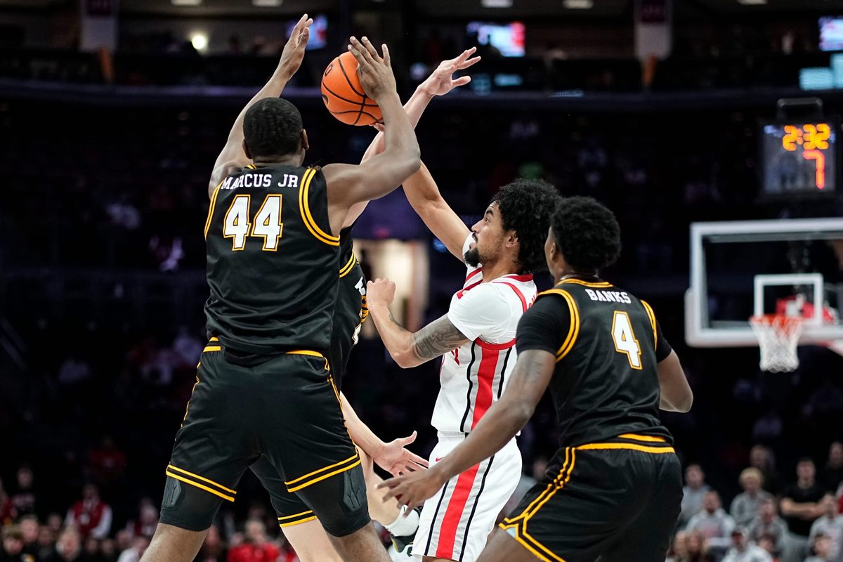 Ohio State Buckeyes guard Taison Chatman (3) passes around Appalachian State Mountaineers forward Michael Marcus Jr. (44) during the NCAA men's basketball game at Value City Arena in Columbus on Nov. 11, 2025. Ohio State won 75-53.