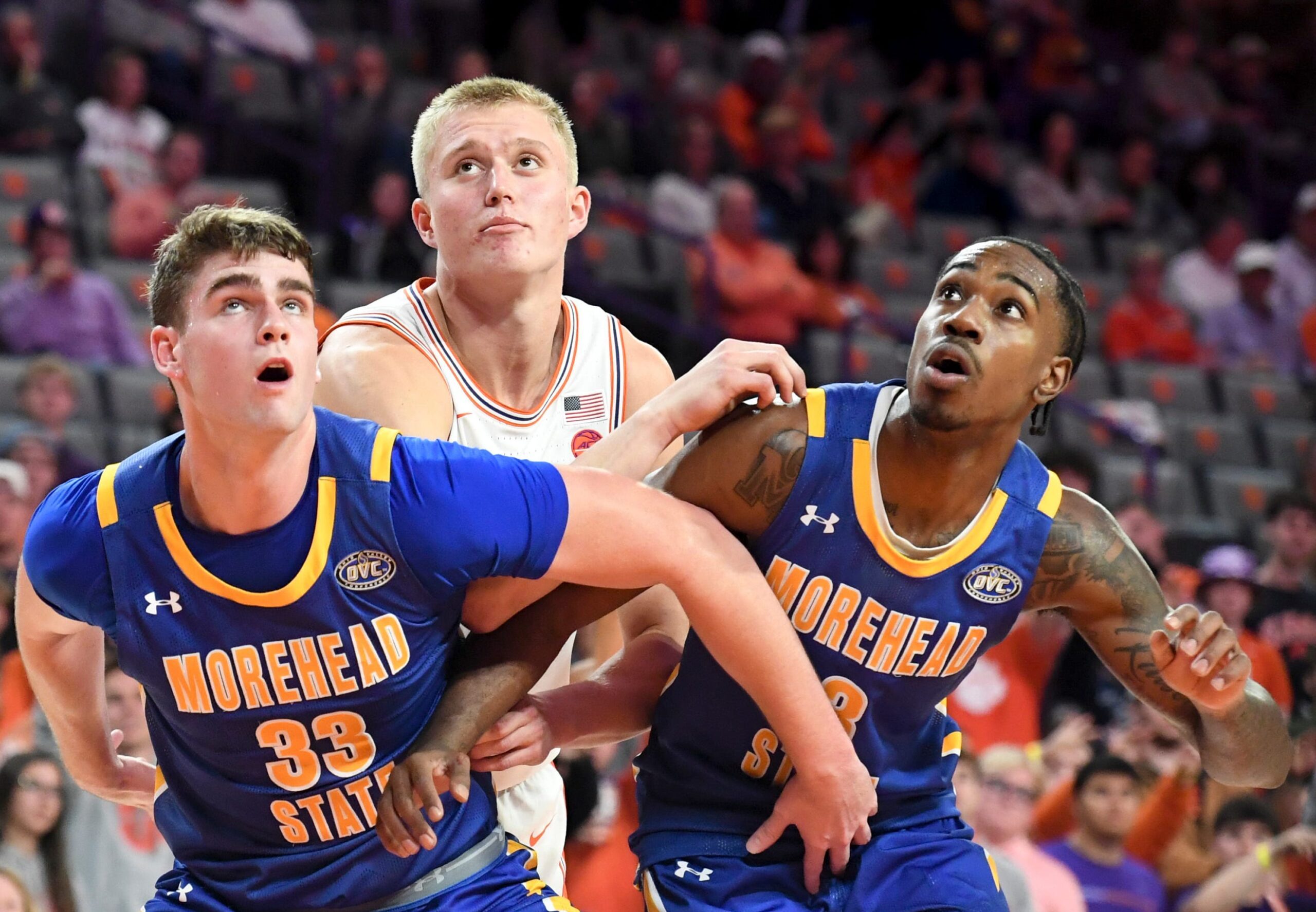 Morehead State Eagles forward Clayton Parker (33) and Morehead State Eagles guard George Marshall (3) box out Clemson Tigers forward Chase Thompson (3) Tuesday, Nov. 11, 2025, during the NCAA men’s basketball game at Littlejohn Coliseum in Clemson, South Carolina. Clemson Tigers won 83-56.