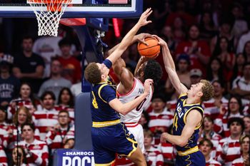 Nov 11, 2025; Tucson, Arizona, USA; Arizona Wildcats forward Tobe Awaka (30) makes a basket while the Northern Arizona Lumberjacks fails to block him during the first half of the game at McKale Memorial Center. Mandatory Credit: Aryanna Frank-Imagn Images