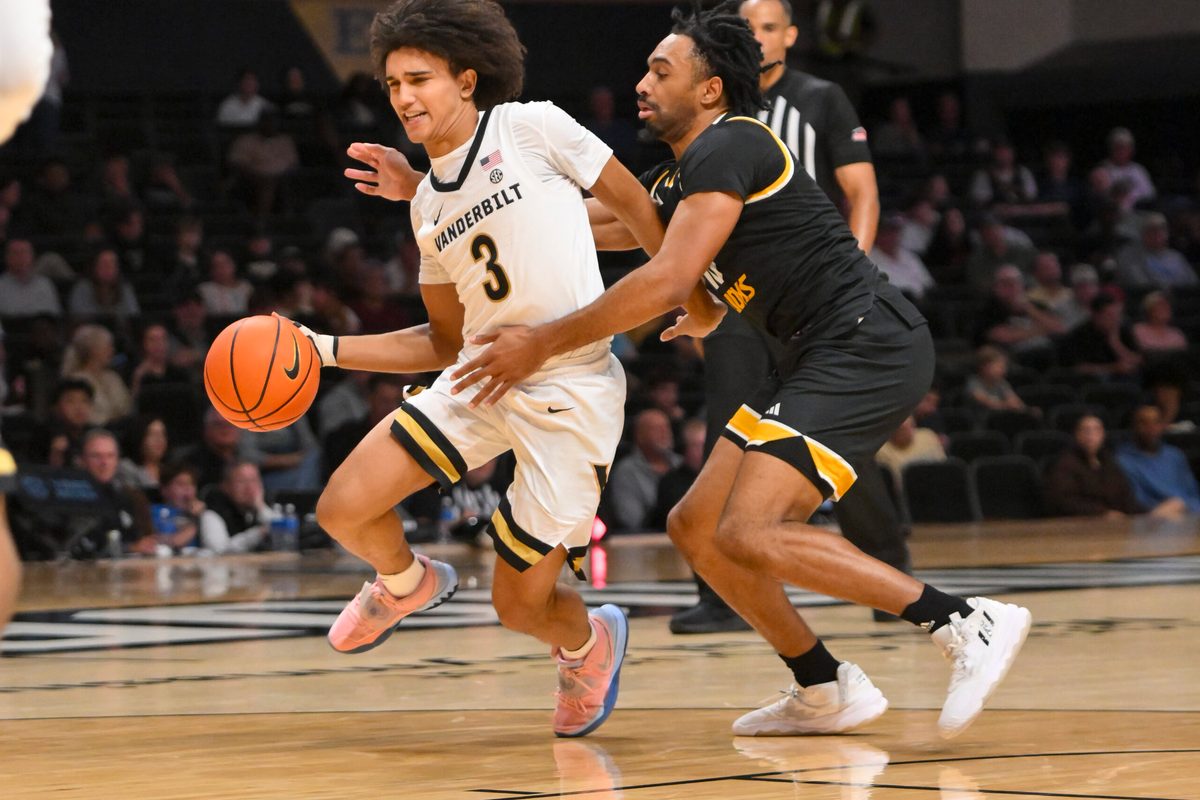 Nov 15, 2025; Nashville, Tennessee, USA; Vanderbilt Commodores guard Tyler Tanner (3) drives to the basket past Arkansas-Pine Bluff Golden Lions guard Quion Williams (13) during the second half at Memorial Gymnasium. Mandatory Credit: Steve Roberts-Imagn Images