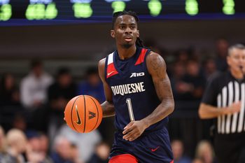 Nov 15, 2025; Villanova, Pennsylvania, USA; Duquesne Dukes guard Tarence Guinyard (1) dribbles up court against the Villanova Wildcats during the second half at William B. Finneran Pavilion. Mandatory Credit: Bill Streicher-Imagn Images