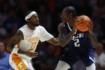 Nov 17, 2025; Knoxville, Tennessee, USA;  Tennessee Volunteers guard Amaree Abram (77) defends Rice Owls guard Jalen Smith (2) during the first half at Thompson-Boling Arena at Food City Center. Mandatory Credit: Randy Sartin-Imagn Images