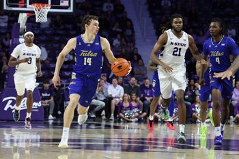Nov 17, 2025; Manhattan, Kansas, USA; Tulsa Golden Hurricane guard Miles Barnstable (14) brings the ball up court during the second half against the Kansas State Wildcats at Bramlage Coliseum. Mandatory Credit: Scott Sewell-Imagn Images