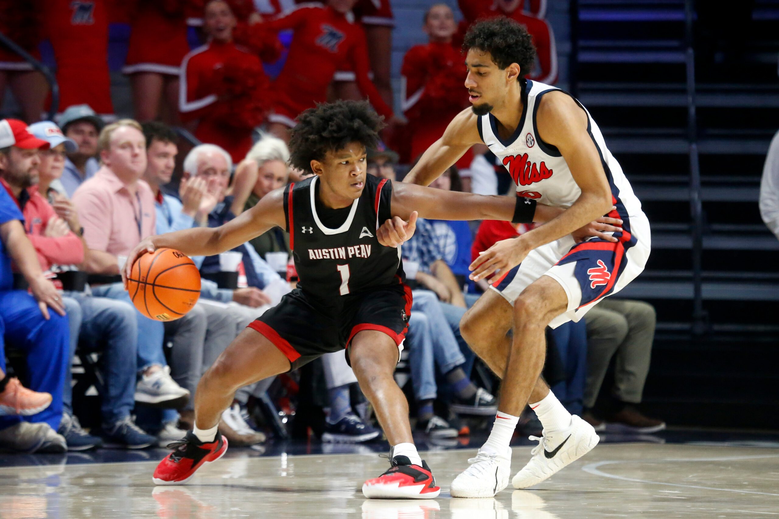 Nov 18, 2025; Oxford, Mississippi, USA; Austin Peay Governors guard Zyree Collins (1) dribbles as Mississippi Rebels guard Ilias Kamardine (6) defends during the second half at The Sandy and John Black Pavilion at Ole Miss. Mandatory Credit: Petre Thomas-Imagn Images
