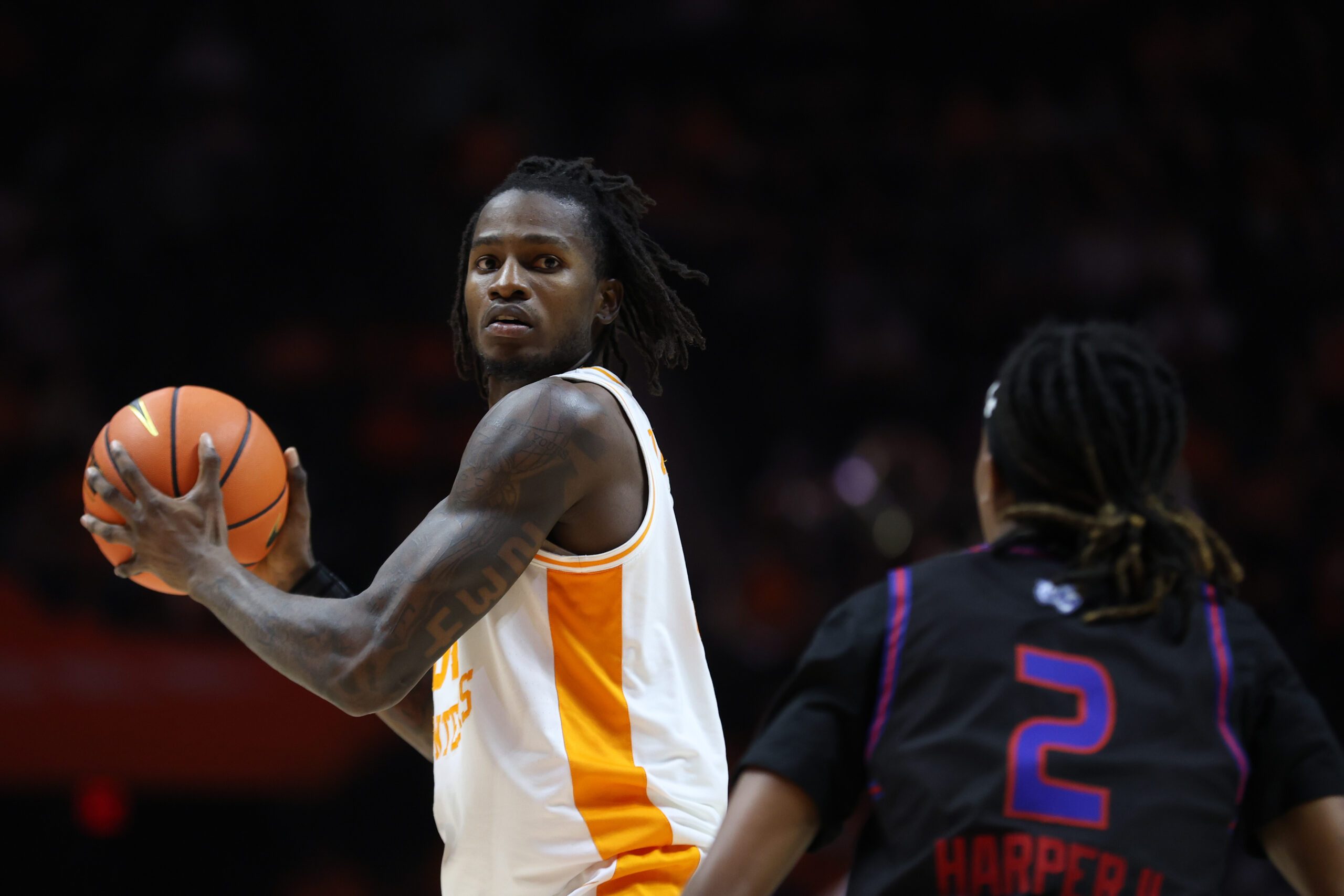 Nov 20, 2025; Knoxville, Tennessee, USA;  Tennessee Volunteers center Felix Okpara (34) moves the ball against Tennessee State Tigers guard Travis Harper II (2) during the first half at Thompson-Boling Arena at Food City Center. Mandatory Credit: Randy Sartin-Imagn Images