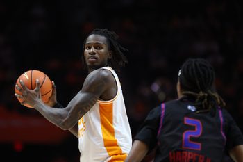 Nov 20, 2025; Knoxville, Tennessee, USA;  Tennessee Volunteers center Felix Okpara (34) moves the ball against Tennessee State Tigers guard Travis Harper II (2) during the first half at Thompson-Boling Arena at Food City Center. Mandatory Credit: Randy Sartin-Imagn Images