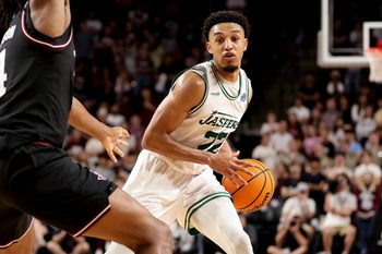 Nov 21, 2025; College Station, Texas, USA; Manhattan Jaspers guard Terrance Jones (22) looks to pass the ball during the second half against the Texas A&M Aggies at Reed Arena. Mandatory Credit: Maria Lysaker-Imagn Images