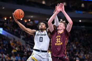 Marquette guard Nigel James Jr. (0) goes to the basket against Central Michigan center Nathan Claerbaut (32) in the first half of a game Saturday, November 22, 2025, at Fiserv Forum in Milwaukee, Wisconsin.