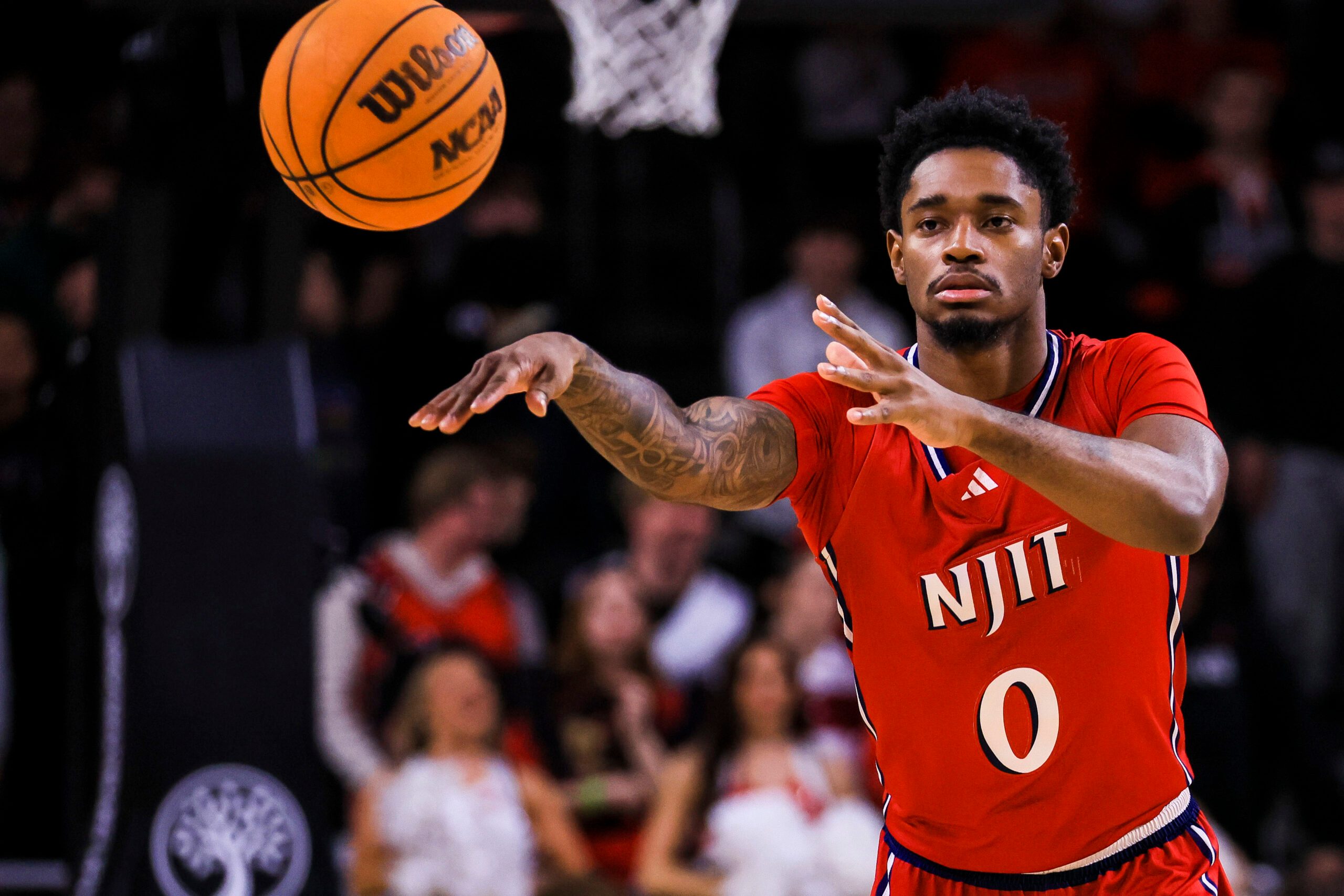Nov 24, 2025; Cincinnati, Ohio, USA; NJIT Highlanders guard Sebastian Robinson (0) passes the ball against the Cincinnati Bearcats in the second half at Fifth Third Arena. Mandatory Credit: Katie Stratman-Imagn Images
