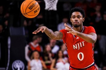 Nov 24, 2025; Cincinnati, Ohio, USA; NJIT Highlanders guard Sebastian Robinson (0) passes the ball against the Cincinnati Bearcats in the second half at Fifth Third Arena. Mandatory Credit: Katie Stratman-Imagn Images