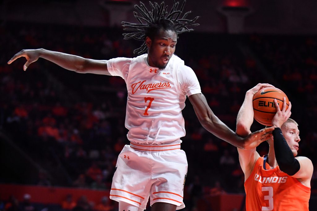 Nov 24, 2025; Champaign, Illinois, USA; Illinois Fighting Illini forward Ben Humrichhous (3) grabs a rebound in front of UT Rio Grande Valley Vaqueros forward Kye Dickson (7) during the second half at State Farm Center. Mandatory Credit: Ron Johnson-Imagn Images