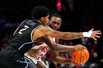 Ohio State Buckeyes guard Bruce Thornton (2) attempts to move the ball against Mount St. Mary's Mountaineers guard Arlandus Keyes (2) in the first half of the NCAA basketball game at Value City Arena on Tuesday, Nov. 25, 2025 in Columbus, Ohio.