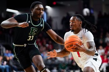 Cincinnati Bearcats guard Day Day Thomas (1) drives the ball to the basket in the first half of a NCAA men’s basketball game between the Cincinnati Bearcats and Eastern Michigan Eagles, Wednesday, Nov. 26, 2025, at Fifth Third Arena in Cincinnati.
