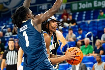The Florida Gulf Coast Eagles compete against the Oral Roberts Golden Eagles in a GEICO Coconut Hoops Tournament Tarpon Bay division game at Alico Arena on Fort Myers, Fla., on Monday, Nov. 24, 2025. Jordan Ellerbee drives to the hoop.