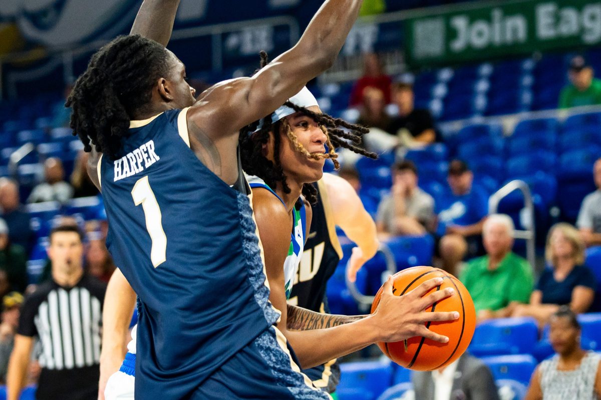 The Florida Gulf Coast Eagles compete against the Oral Roberts Golden Eagles in a GEICO Coconut Hoops Tournament Tarpon Bay division game at Alico Arena on Fort Myers, Fla., on Monday, Nov. 24, 2025. Jordan Ellerbee drives to the hoop.
