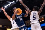 Nevada Wolf Pack guard Tayshawn Comer (12) is fouled as he goes up for a shot during the first half of their game in the Acrisure Series in Palm Desert, Calif., Thursday, Nov. 27, 2025.
