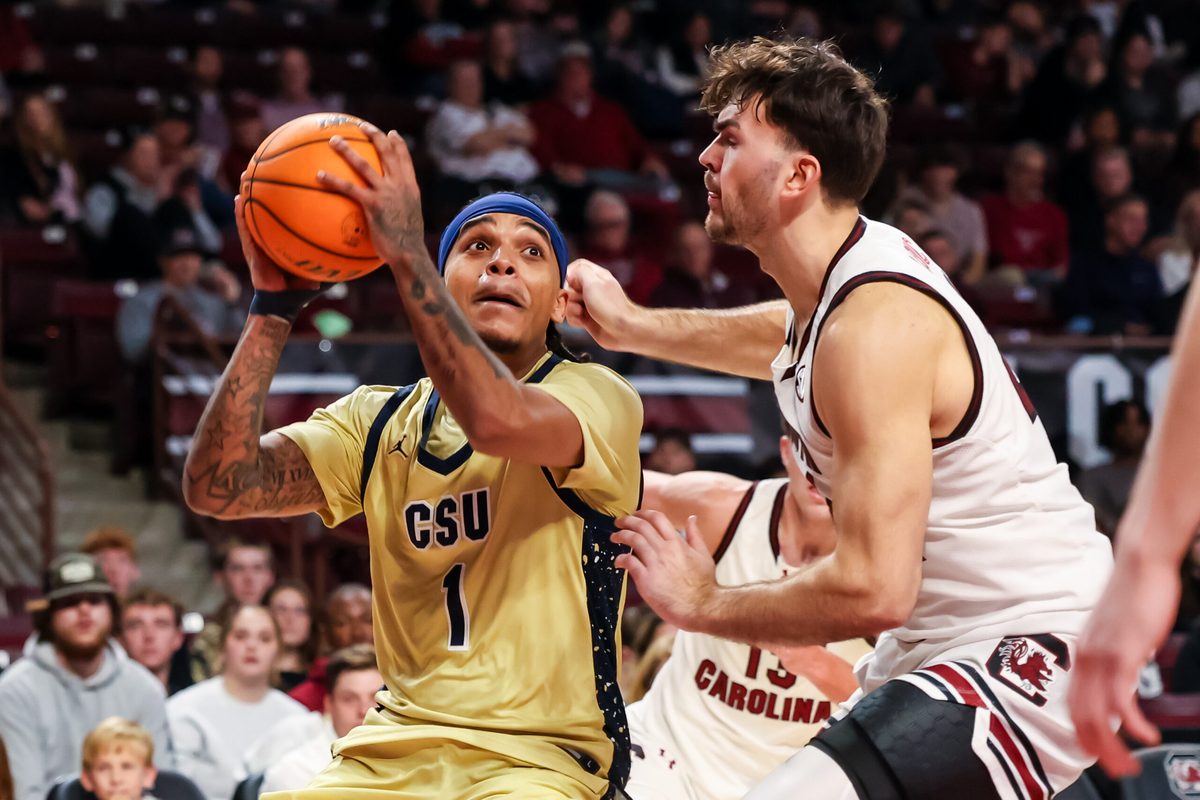 Nov 28, 2025; Columbia, South Carolina, USA; Charleston Southern Buccaneers guard A'Lahn Sumler (1) shoots over South Carolina Gamecocks forward Nordin Kapic (24) in the second half at Colonial Life Arena. Mandatory Credit: Jeff Blake-Imagn Images