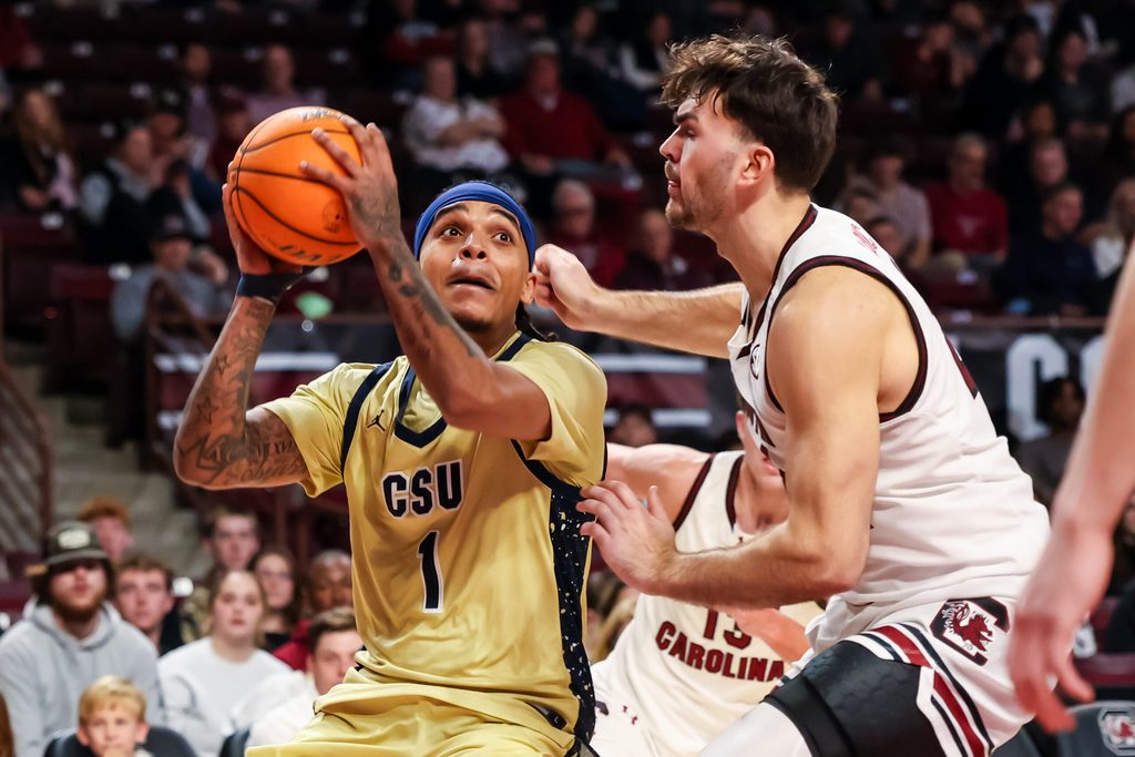 Nov 28, 2025; Columbia, South Carolina, USA; Charleston Southern Buccaneers guard A'Lahn Sumler (1) shoots over South Carolina Gamecocks forward Nordin Kapic (24) in the second half at Colonial Life Arena. Mandatory Credit: Jeff Blake-Imagn Images