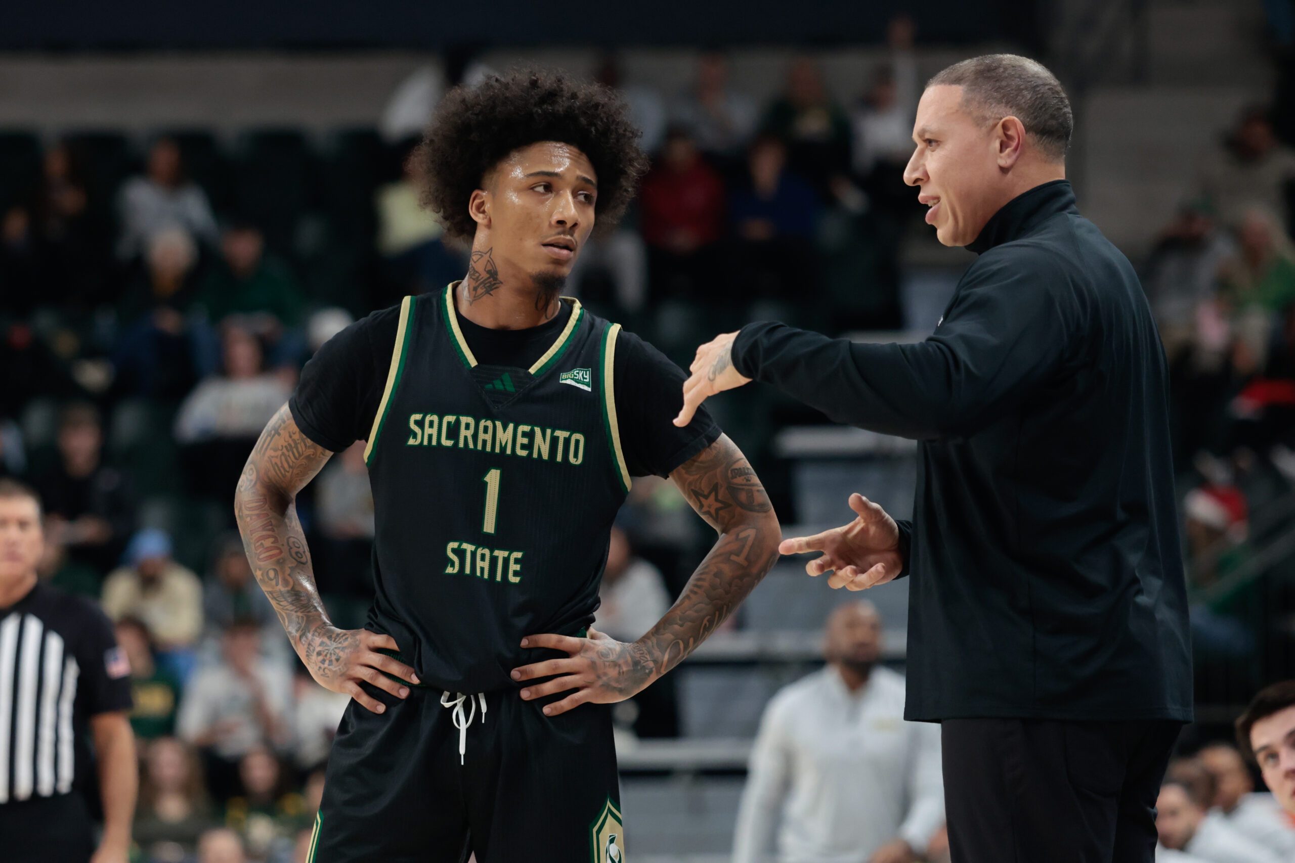 Dec 2, 2025; Waco, Texas, USA;  Sacramento State Hornets head coach Mike Bibby speaks with Sacramento State Hornets guard Mikey Williams (1) during a break in play during the first half against the Baylor Bears at Paul and Alejandra Foster Pavilion. Mandatory Credit: Chris Jones-Imagn Images