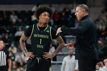 Dec 2, 2025; Waco, Texas, USA;  Sacramento State Hornets head coach Mike Bibby speaks with Sacramento State Hornets guard Mikey Williams (1) during a break in play during the first half against the Baylor Bears at Paul and Alejandra Foster Pavilion. Mandatory Credit: Chris Jones-Imagn Images