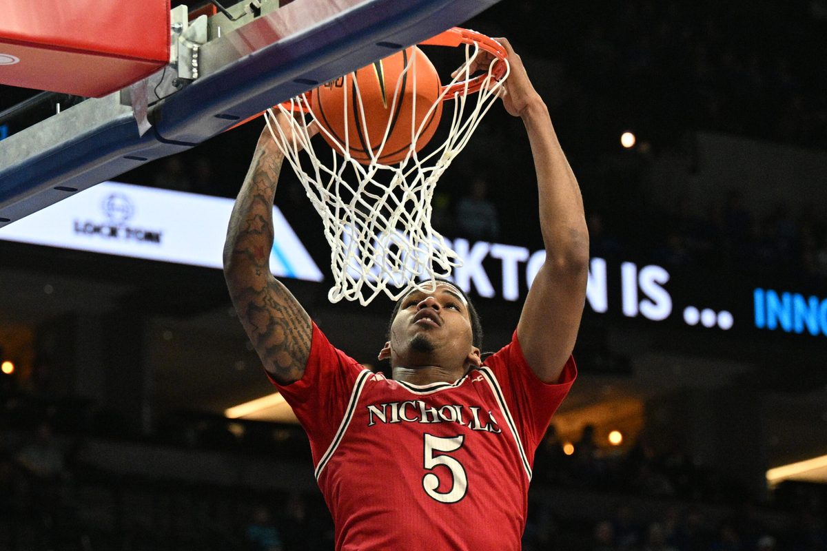 Dec 2, 2025; Omaha, Nebraska, USA; Nicholls State Colonels forward Sincere Malone (5) dunks against the Creighton Bluejays during the first half at CHI Health Center Omaha. Mandatory Credit: Steven Branscombe-Imagn Images