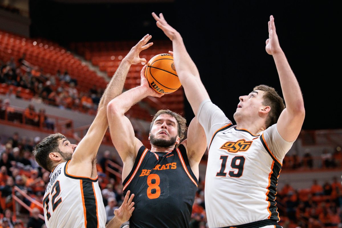 Dec 2, 2025; Stillwater, Oklahoma, USA; Sam Houston Bearkats forward Veljko Ilic (8) shoots the ball around Oklahoma State Cowboys forward Lefteris Mantzoukas (72) and Oklahoma State Cowboys forward Andrija Vukovic (19) during the second half at Gallagher-Iba Arena. Mandatory Credit: William Purnell-Imagn Images