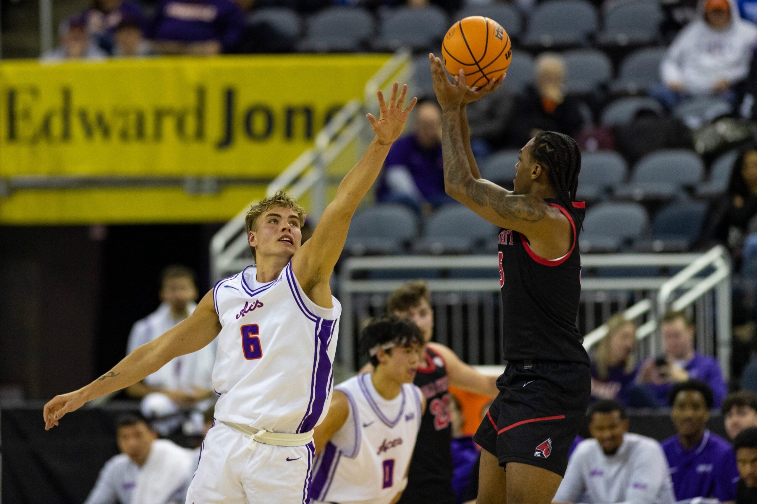 Ball State's Armoni Zeigler (5) takes a shot over Evansville's Leif Moeller (6) as the University of Evansville Purple Aces play the Ball State University Cardinals at Ford Center in Evansville, Ind., Wednesday, Dec. 3, 2025.