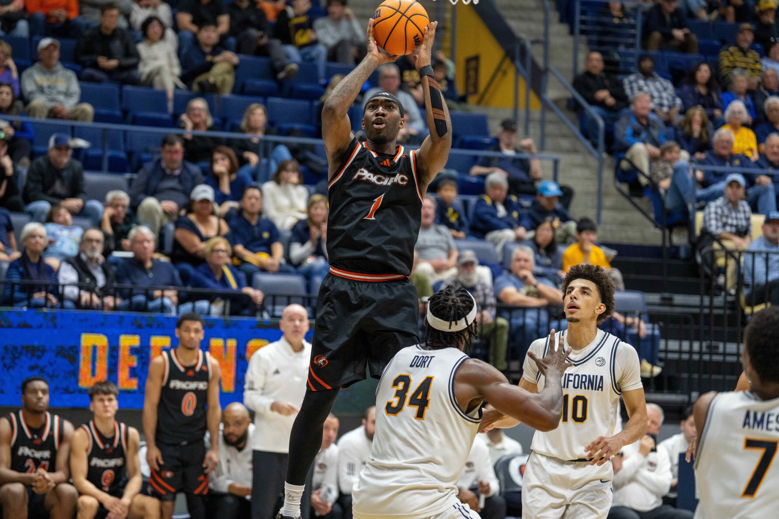 Dec 6, 2025; Berkeley, California, USA; Pacific Tigers guard Justin Rochelin (1) shoots the basketball over California Golden Bears forward Lee Dort (34) during the second half at Haas Pavilion. Mandatory Credit: Neville E. Guard-Imagn Images