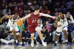 Dec 6, 2025; Philadelphia, PA, USA; Penn Quakers forward Ethan Roberts (23) brings the ball up court against Villanova Wildcats guard Malachi Palmer (7) and forward Tafara Gapare (6) at Xfinity Mobile Arena. Mandatory Credit: Bill Streicher-Imagn Images