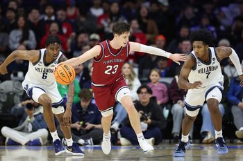 Dec 6, 2025; Philadelphia, PA, USA; Penn Quakers forward Ethan Roberts (23) brings the ball up court against Villanova Wildcats guard Malachi Palmer (7) and forward Tafara Gapare (6) at Xfinity Mobile Arena. Mandatory Credit: Bill Streicher-Imagn Images