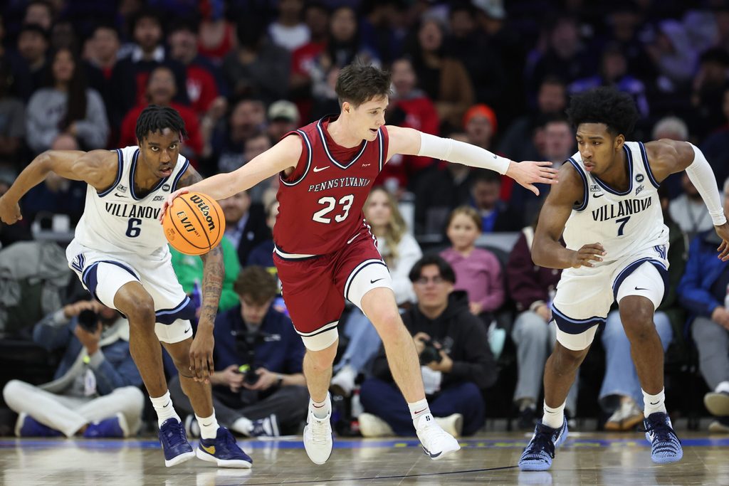 Dec 6, 2025; Philadelphia, PA, USA; Penn Quakers forward Ethan Roberts (23) brings the ball up court against Villanova Wildcats guard Malachi Palmer (7) and forward Tafara Gapare (6) at Xfinity Mobile Arena. Mandatory Credit: Bill Streicher-Imagn Images